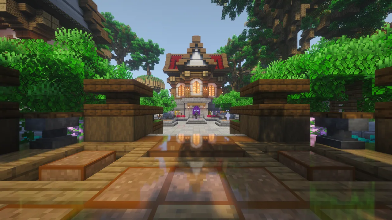 Sunlit wooden walkway leading toward the lobby courtyard and portal