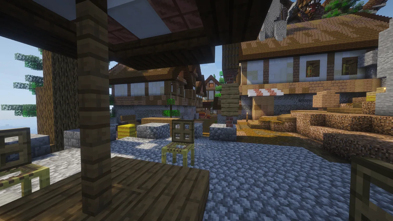 A shaded medieval market street, timber buildings, seats and stone paths